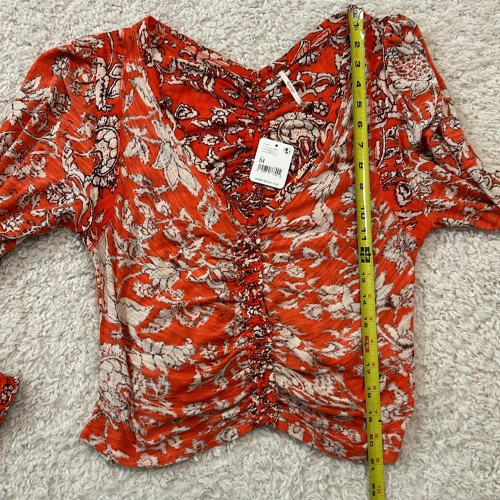 NWT FREE PEOPLE M Say the Word top with balloon sleeves in funky V neck style